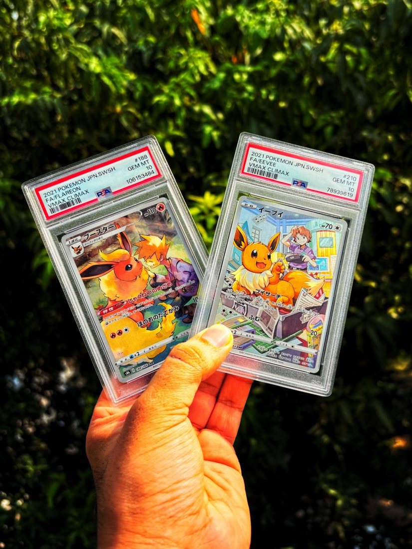 A Pokémon card held up outdoors