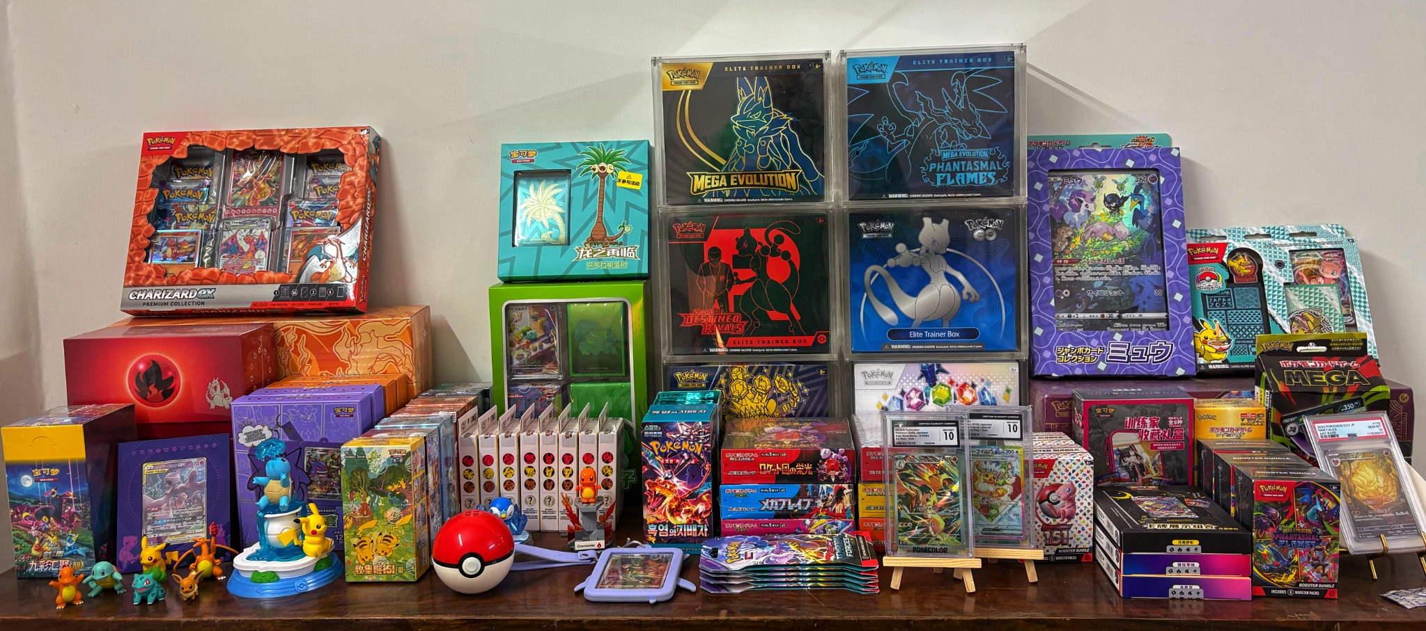 A shelf of Pokémon TCG products from the collection